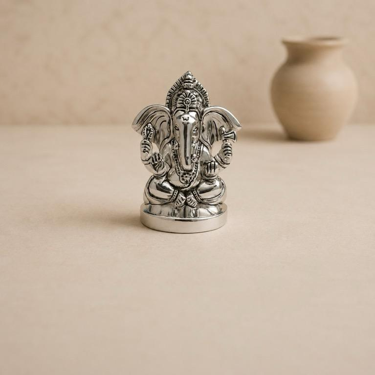 Vighnaharta silver-finish Ganesh idol, handcrafted resin