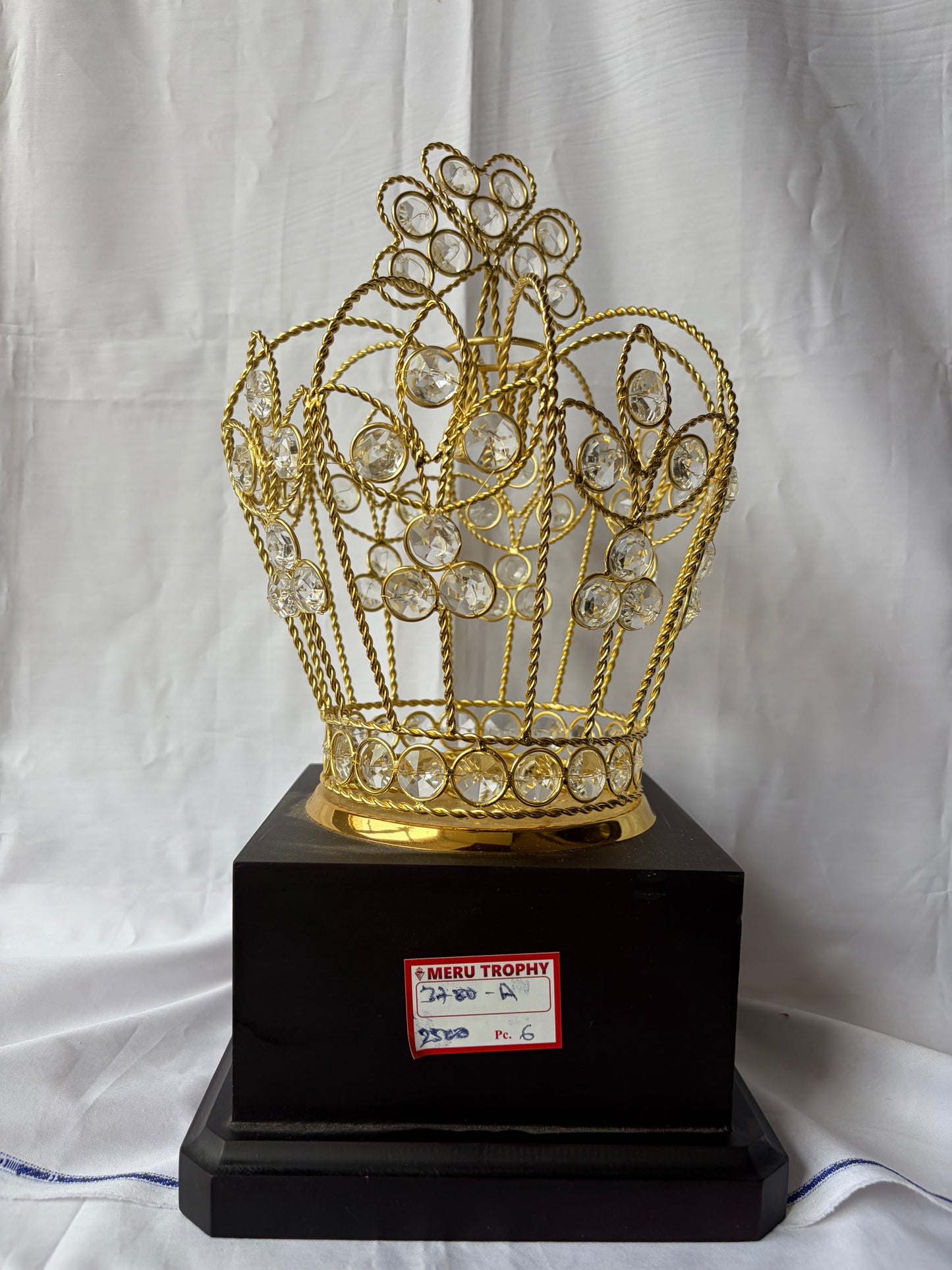Elegant 3780 golden crown trophy with sparkling crystals on a black base, perfect for decorative award plaques.