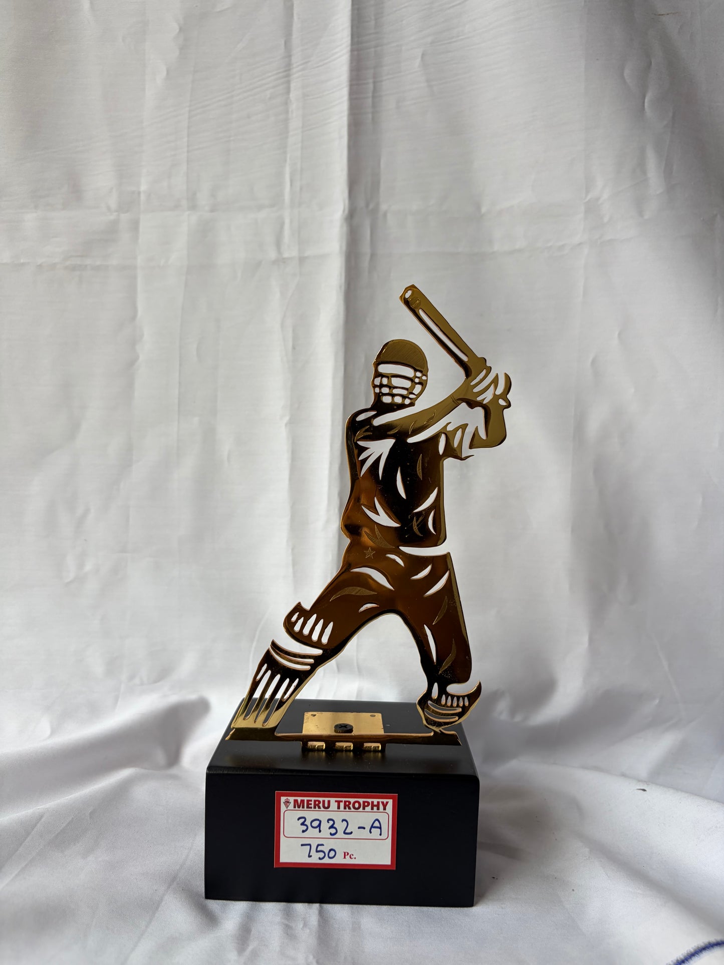 Gold cricket batsman silhouette on a black base, perfect for sports trophies and cricket player recognition awards.