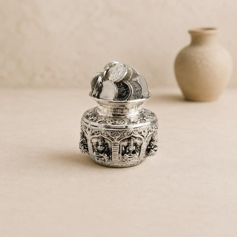Dhan Manjusha silver-finish coin pot showpiece, handcrafted resin