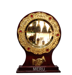 Ornate wooden trophy with gold plate.