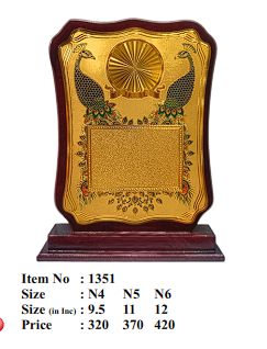 Gold emblem and laurel wreath on a custom engraved wooden trophy.